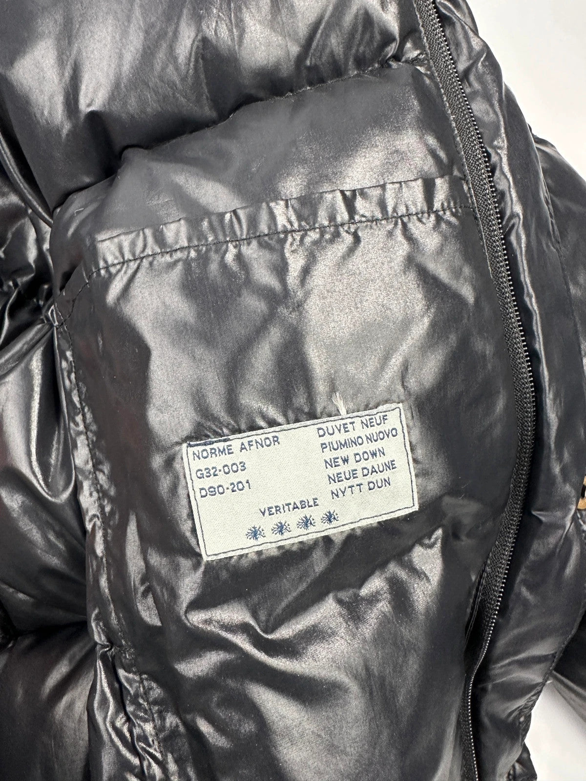 Moncler black nylon hooded puffer jacket with vintage logo and down filling.