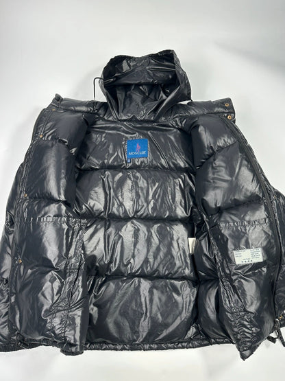 Moncler black nylon hooded puffer jacket with vintage logo and down filling.