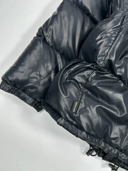 Moncler black nylon hooded puffer jacket with vintage logo and down filling.