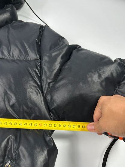 Moncler black nylon hooded puffer jacket with vintage logo and down filling.