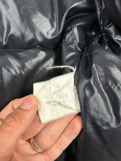 Moncler black nylon hooded puffer jacket with vintage logo and down filling.
