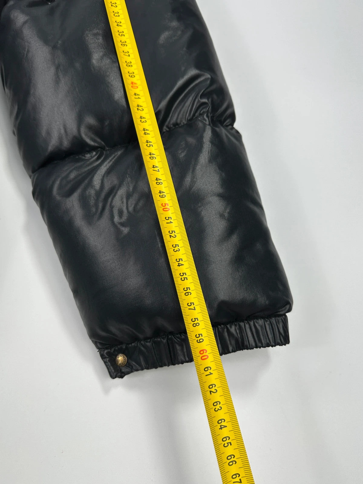 Moncler black nylon hooded puffer jacket with vintage logo and down filling.