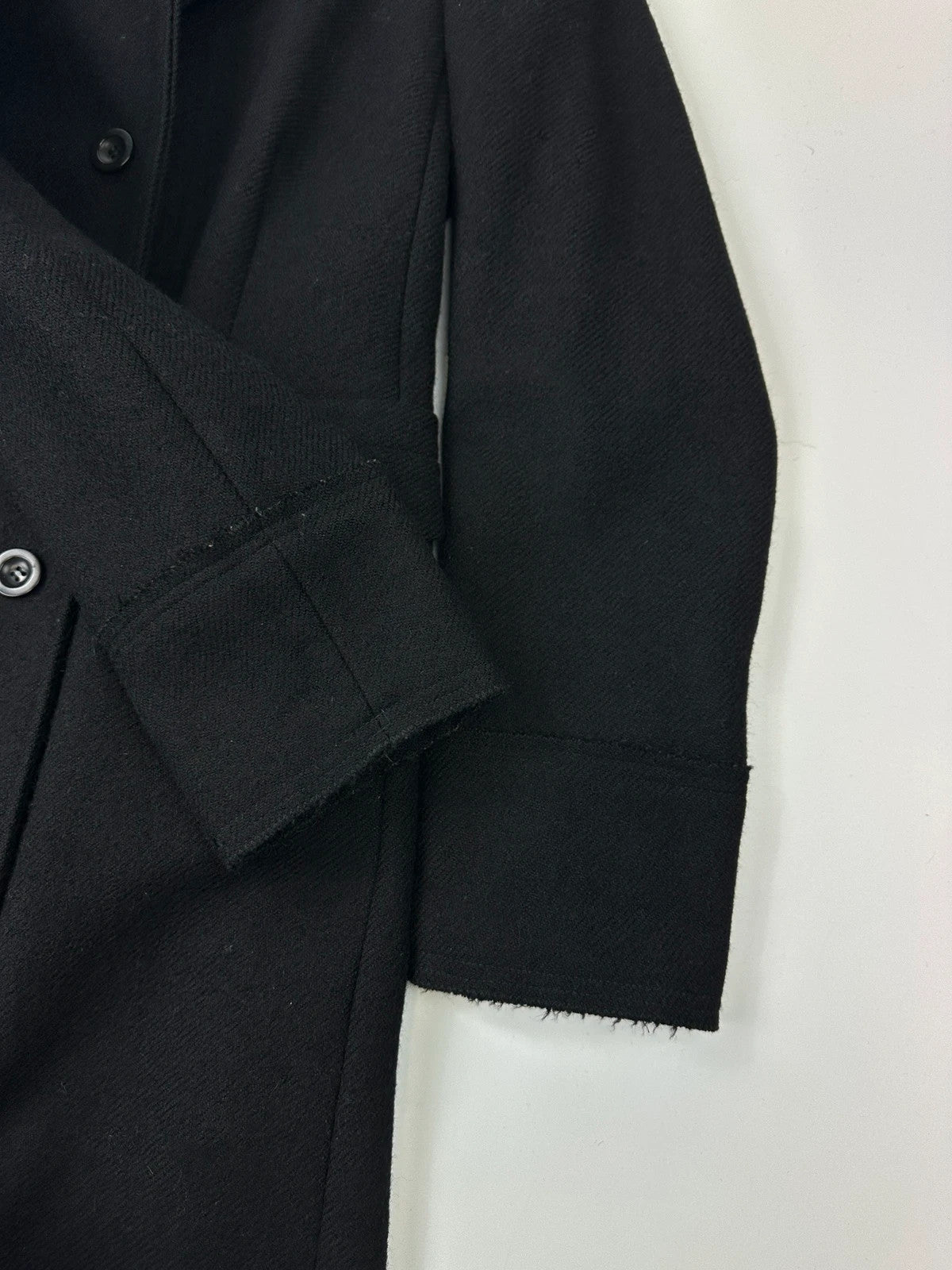 Miu Miu black trench coat in wool and mohair with vintage logo detail.
