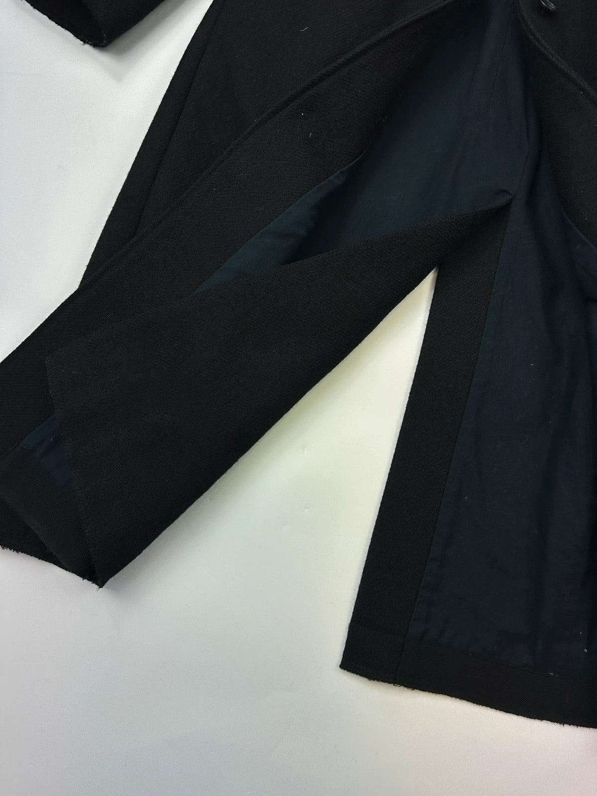 Miu Miu black trench coat in wool and mohair with vintage logo detail.