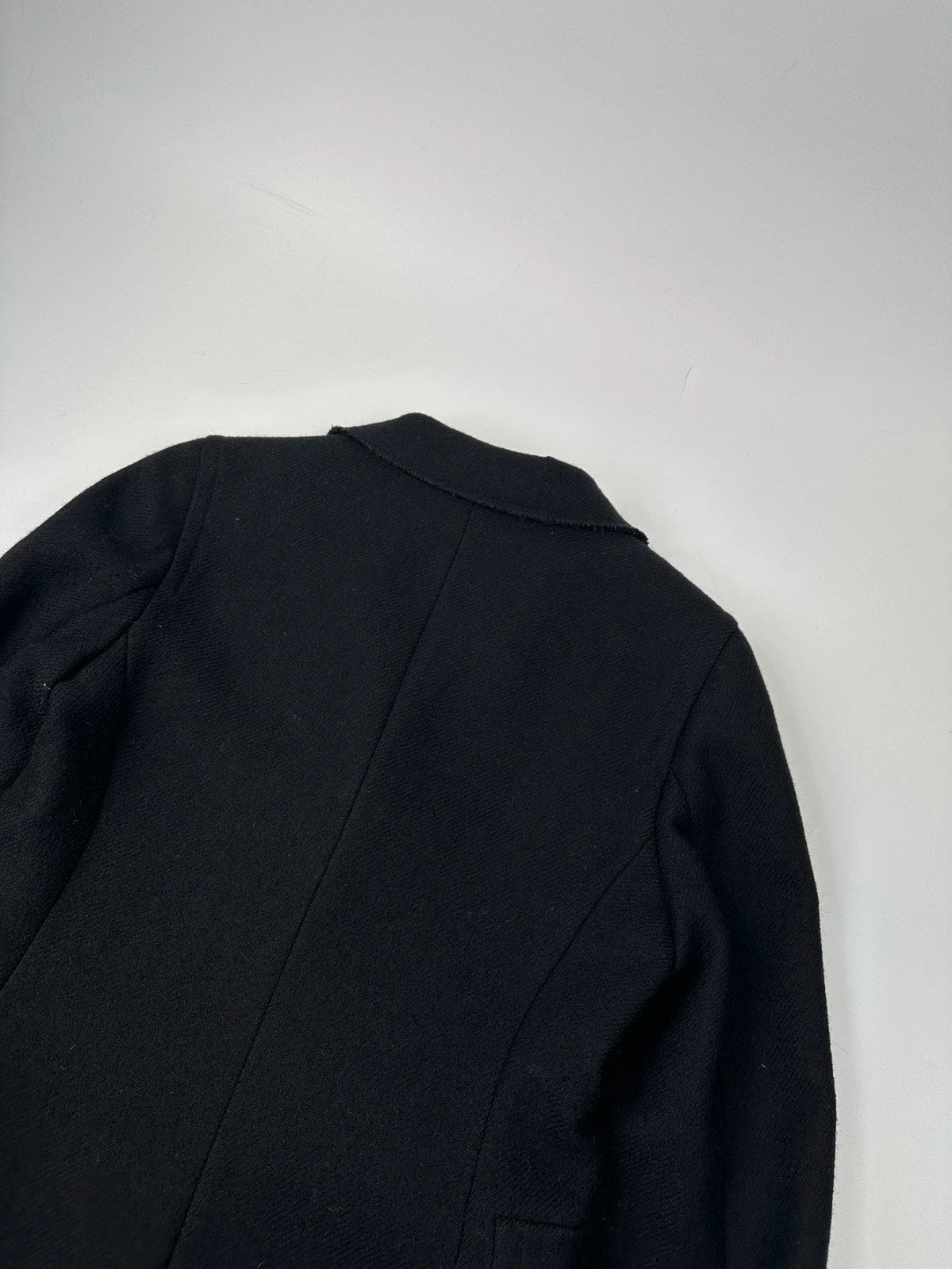 Miu Miu black trench coat in wool and mohair with vintage logo detail.