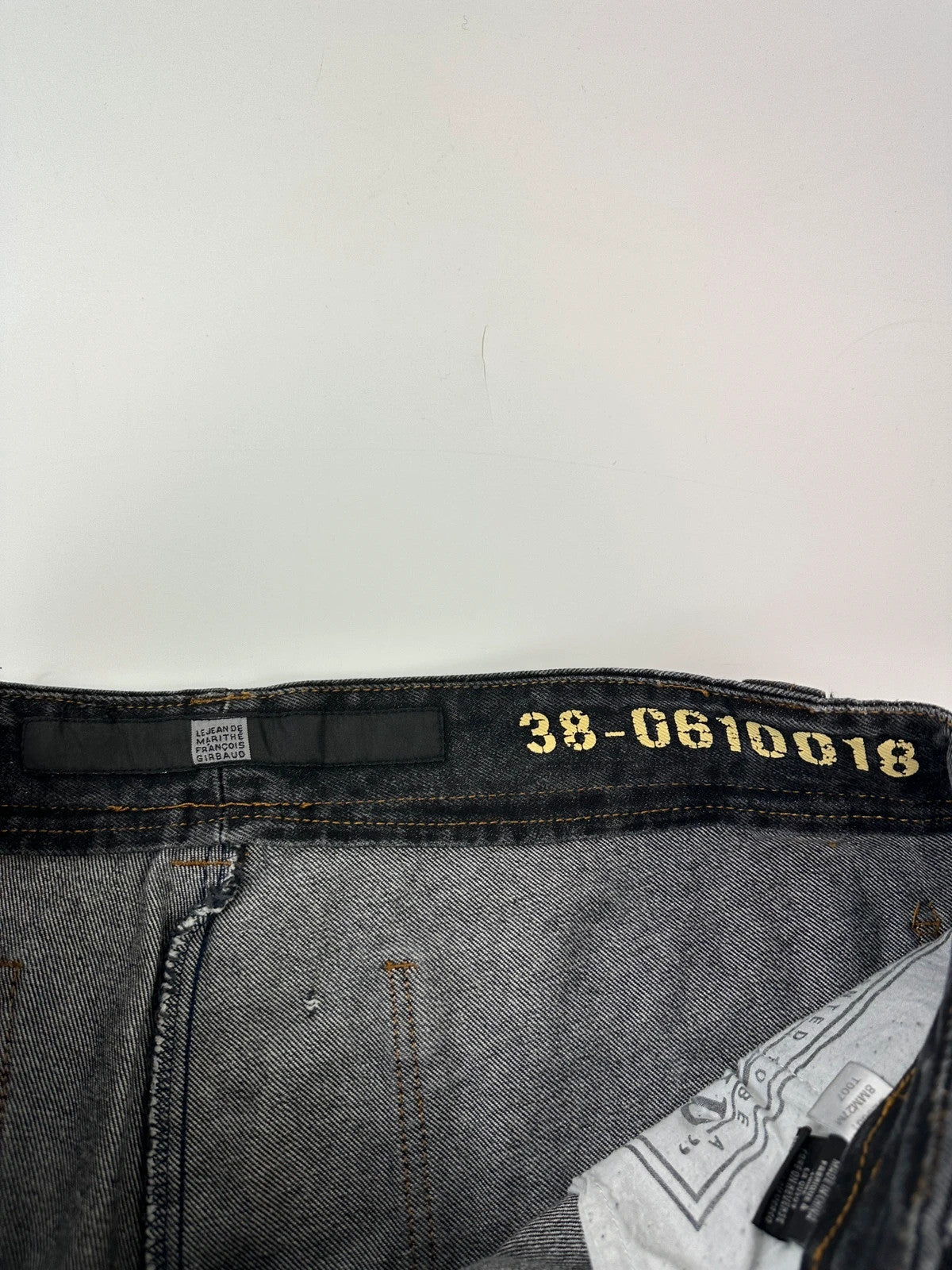 Marithé François Girbaud black and turquoise baggy denim trousers with cargo pockets and velcro details.
