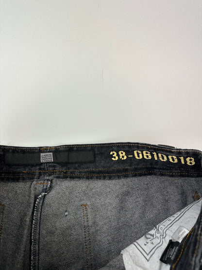 Marithé François Girbaud black and turquoise baggy denim trousers with cargo pockets and velcro details.