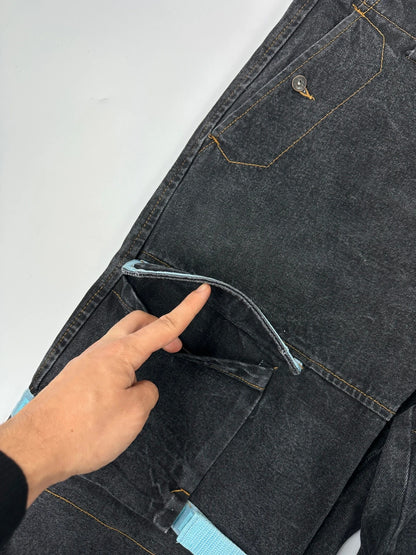 Marithé François Girbaud black and turquoise baggy denim trousers with cargo pockets and velcro details.