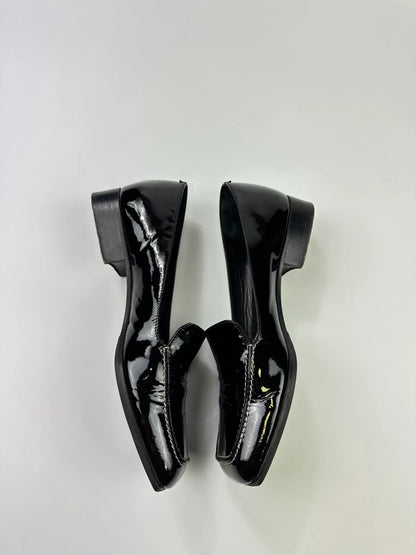 Jil Sander black patent leather loafers with shiny finish and minimalist design.