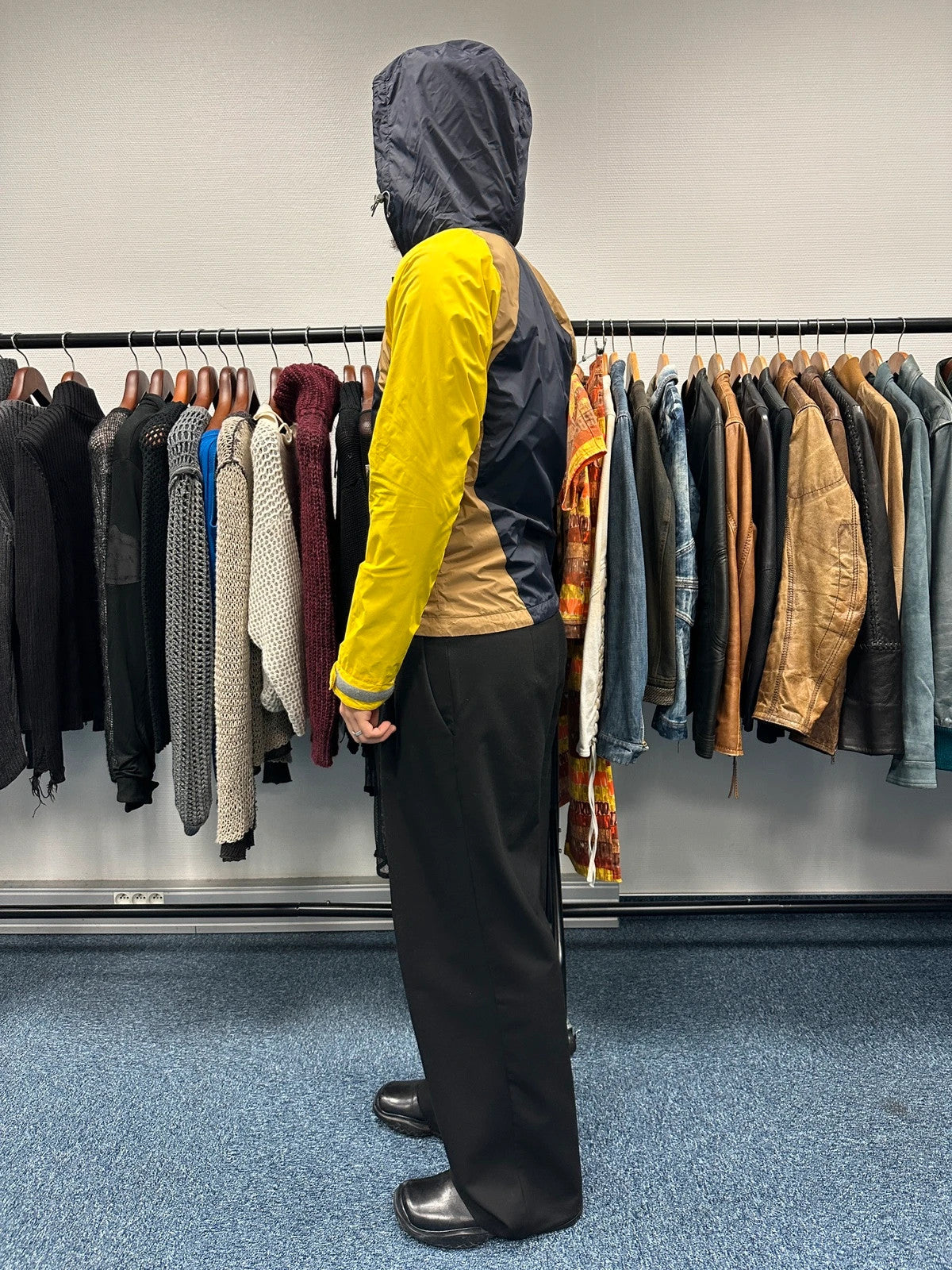 Comme Des Garçons navy and yellow block nylon hooded jacket with logo detail.
