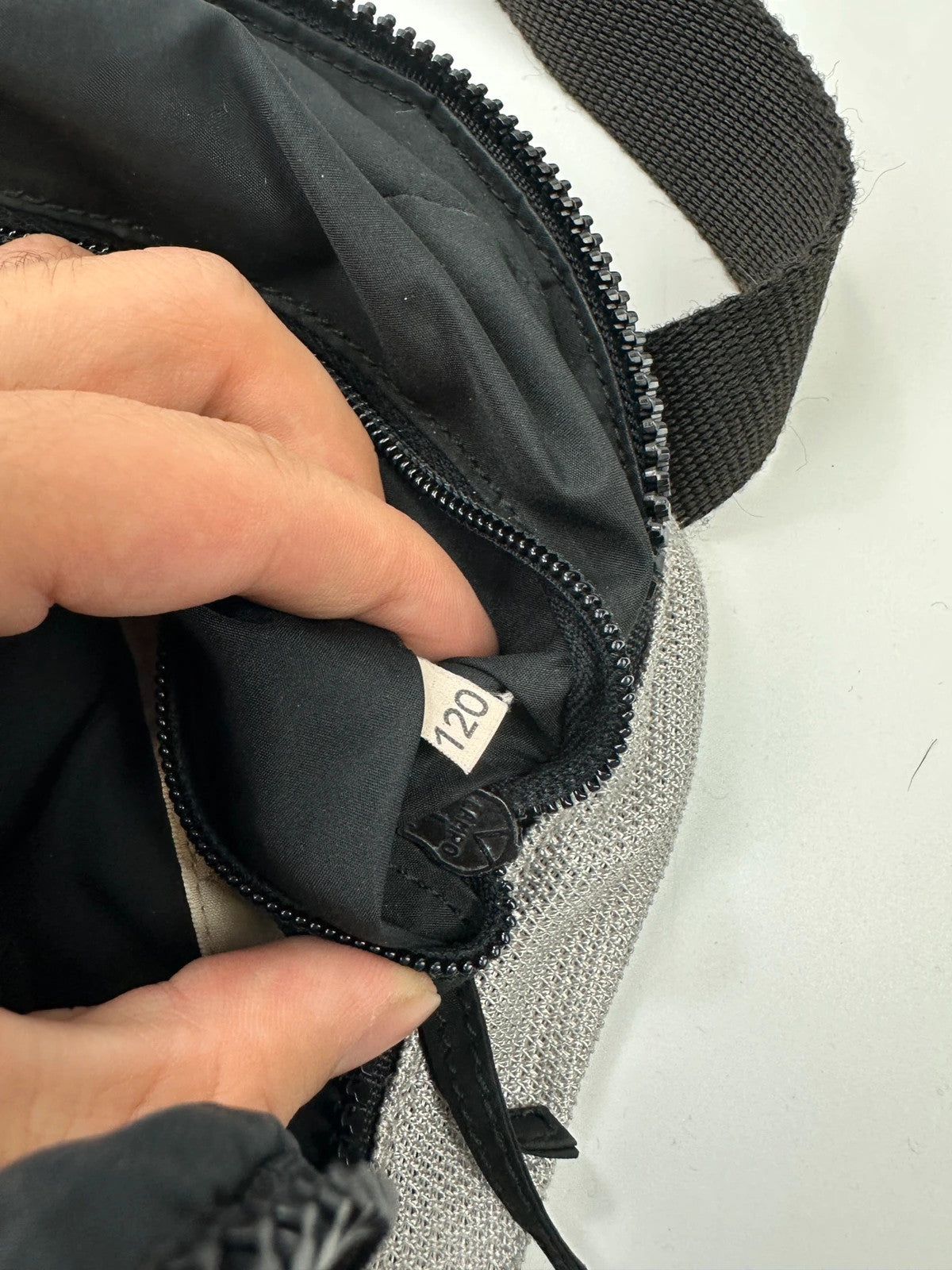 Miu Miu grey mesh 2in1 chest bag backpack, faded logo, minimalist design.