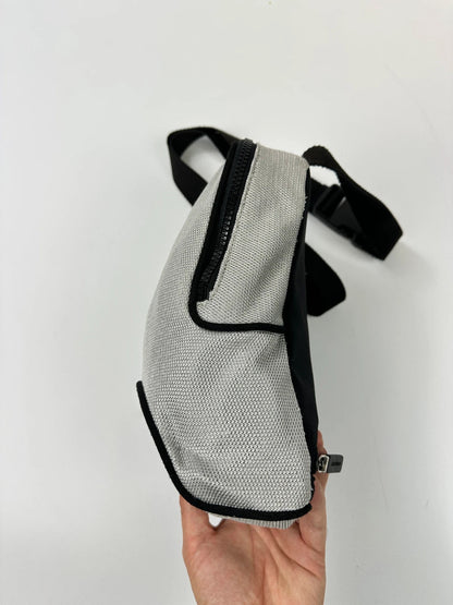 Miu Miu grey mesh 2in1 chest bag backpack, faded logo, minimalist design.