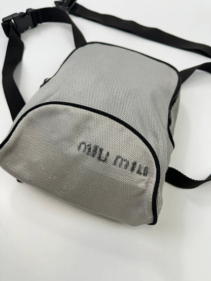 Miu Miu grey mesh 2in1 chest bag backpack, faded logo, minimalist design.