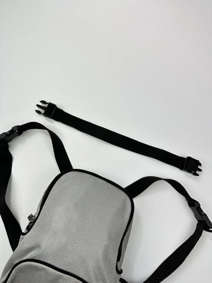 Miu Miu grey mesh 2in1 chest bag backpack, faded logo, minimalist design.
