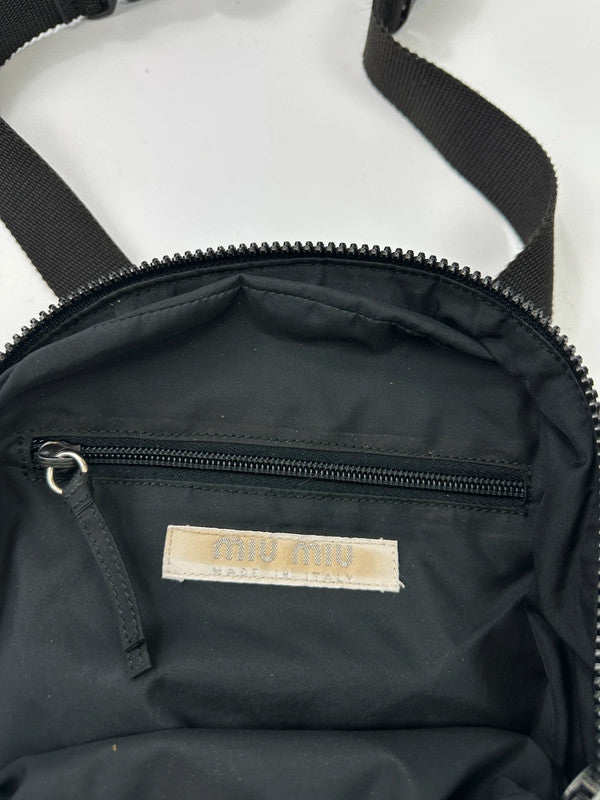 Miu Miu grey mesh 2-in-1 chest bag backpack with faded logo and minimalist design.