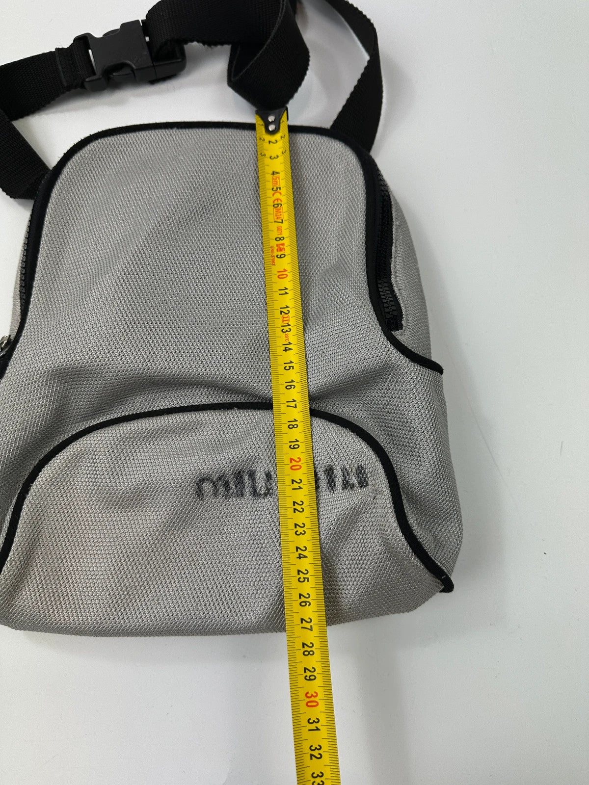 Miu Miu grey mesh 2in1 chest bag backpack, faded logo, minimalist design.