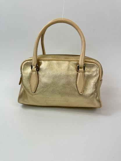 Miu Miu gold leather mini handbag with shiny glitter finish and logo detail.