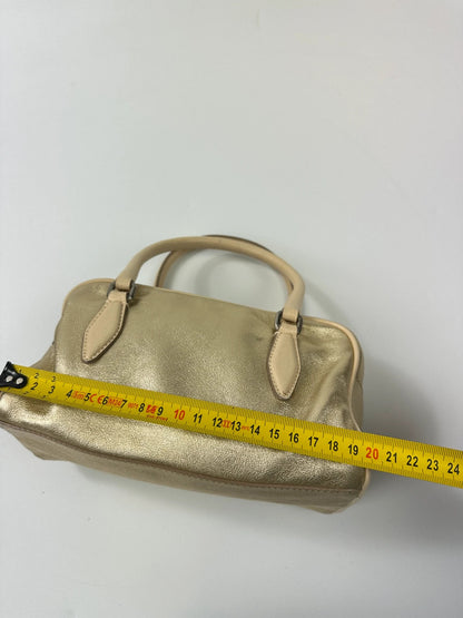 Miu Miu gold leather mini handbag with shiny glitter finish and logo detail.