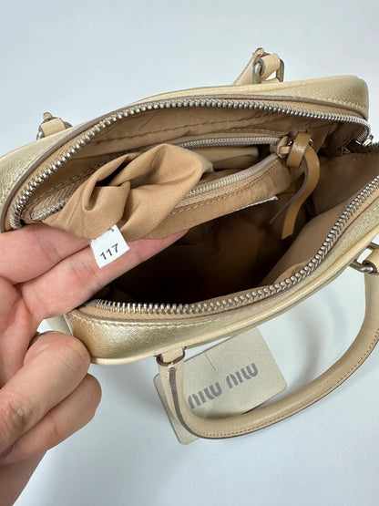 Miu Miu gold leather mini handbag with shiny glitter finish and logo detail.