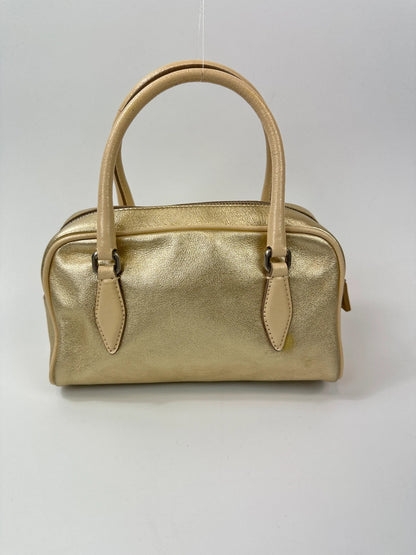 Miu Miu gold leather mini handbag with shiny glitter finish and logo detail.