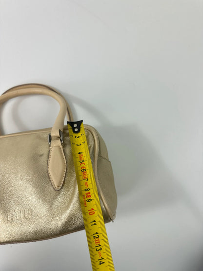 Miu Miu gold leather mini handbag with shiny glitter finish and logo detail.