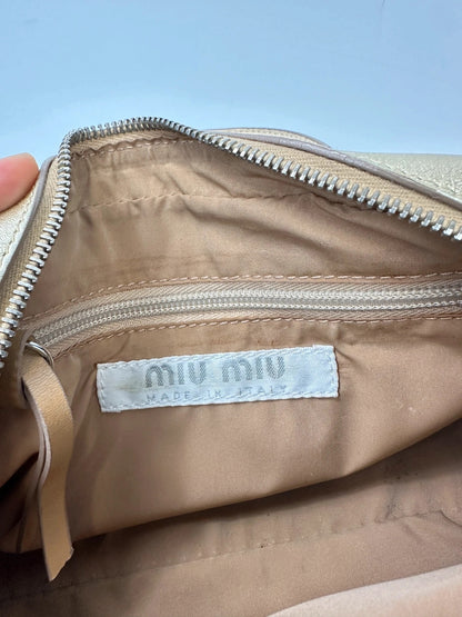 Miu Miu gold leather mini handbag with shiny glitter finish and logo detail.