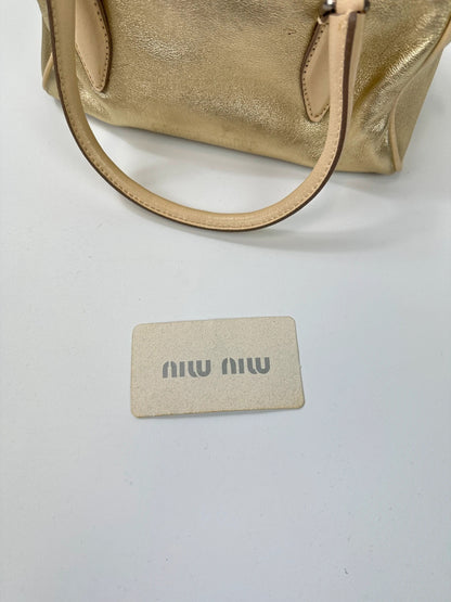 Miu Miu gold leather mini handbag with shiny glitter finish and logo detail.