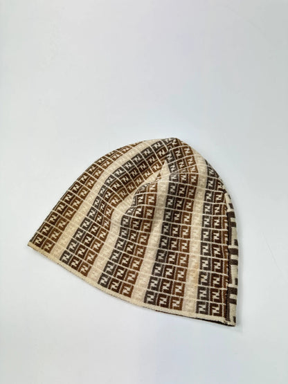 Fendi beige brown beanie featuring iconic monogram pattern and soft wool material.