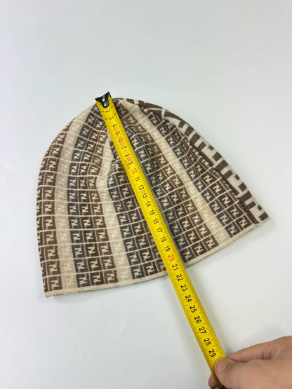 Fendi beige brown beanie featuring iconic monogram pattern and soft wool material.