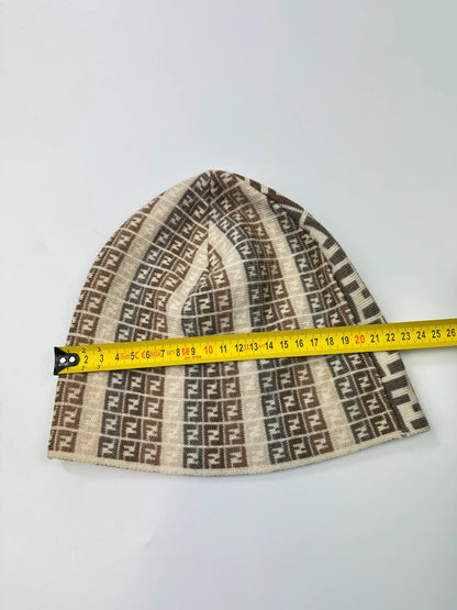 Fendi beige brown beanie featuring iconic monogram pattern and soft wool material.