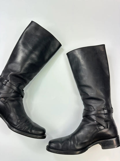 Prada black leather knee-high boots with high belt detail and minimalist design.