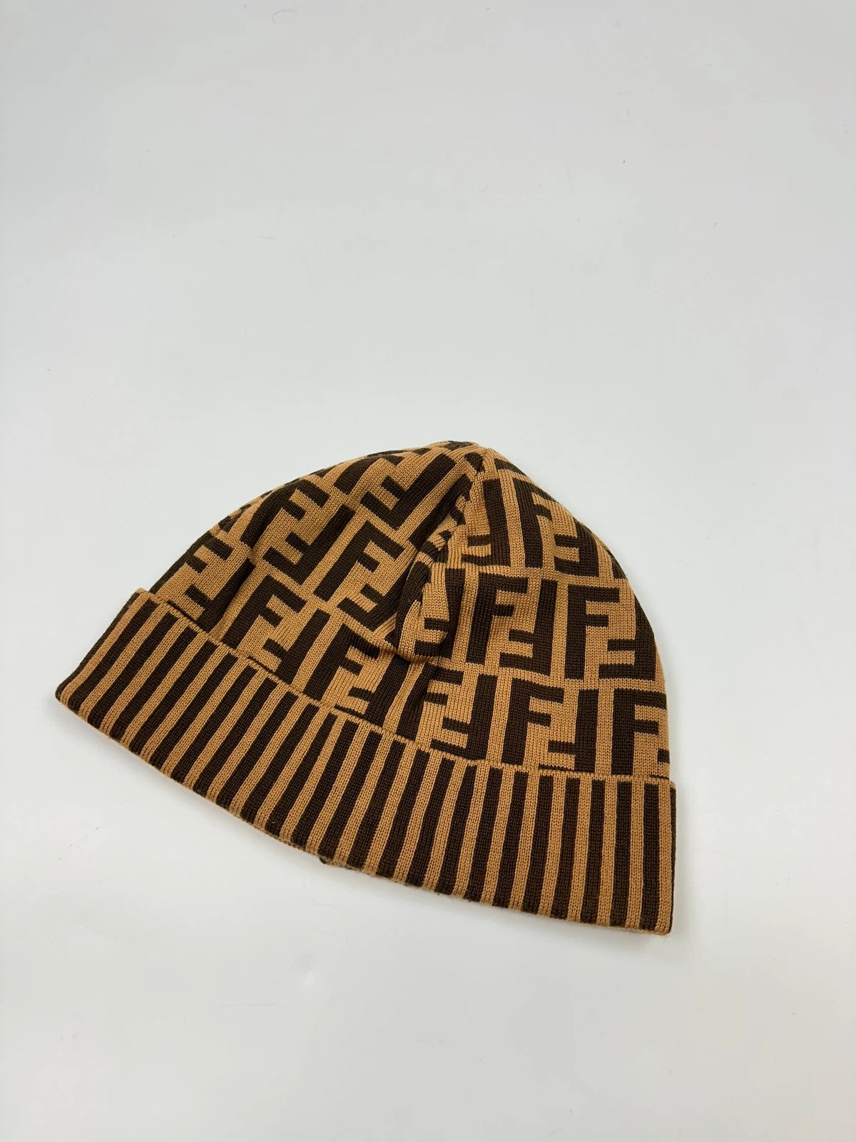 Fendi brown and mustard wool beanie featuring iconic FF monogram pattern.