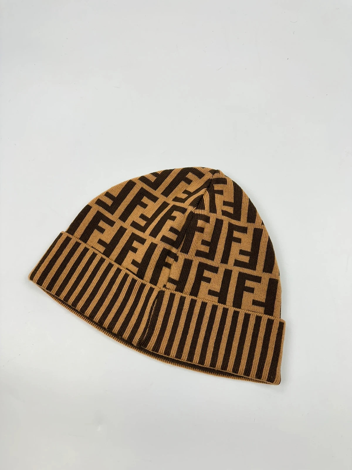 Fendi brown and mustard wool beanie featuring iconic FF monogram pattern.
