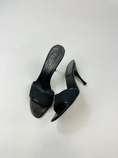 Gucci black heels with canvas monogram pattern and leather accents from the 2000s.