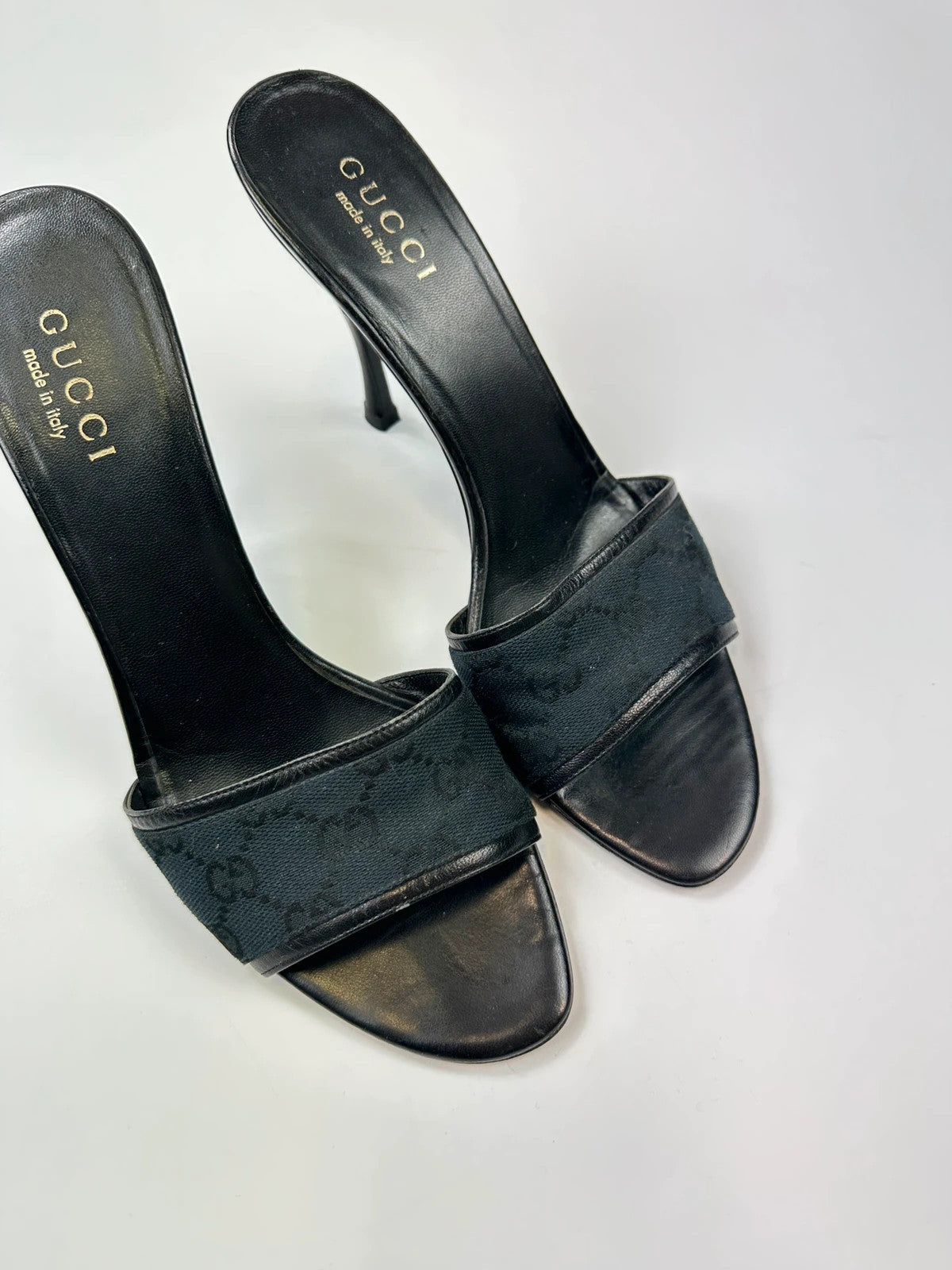 Gucci black heels with canvas monogram pattern and leather accents from the 2000s.