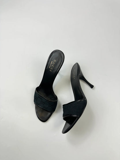 Gucci black heels with canvas monogram pattern and leather accents from the 2000s.