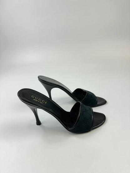 Gucci black heels with canvas monogram pattern and leather accents from the 2000s.