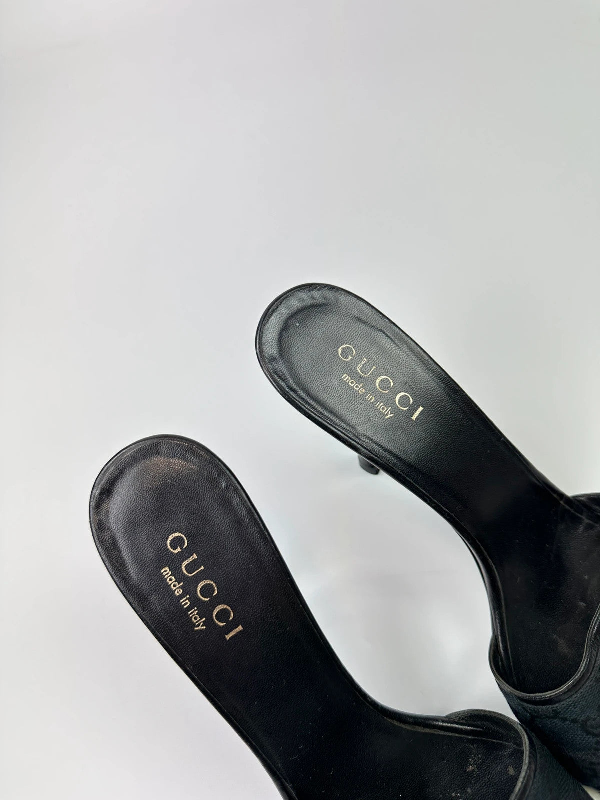 Gucci black heels with canvas monogram pattern and leather accents from the 2000s.