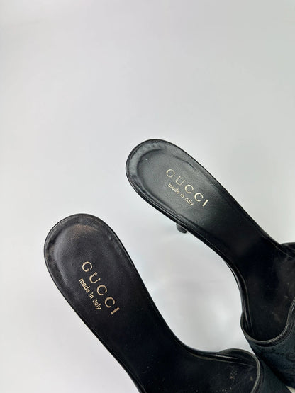 Gucci black heels with canvas monogram pattern and leather accents from the 2000s.