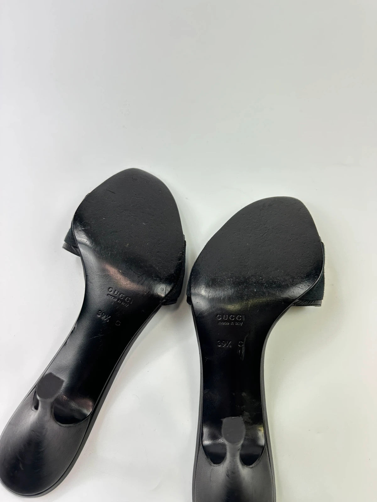Gucci black heels with canvas monogram pattern and leather accents from the 2000s.