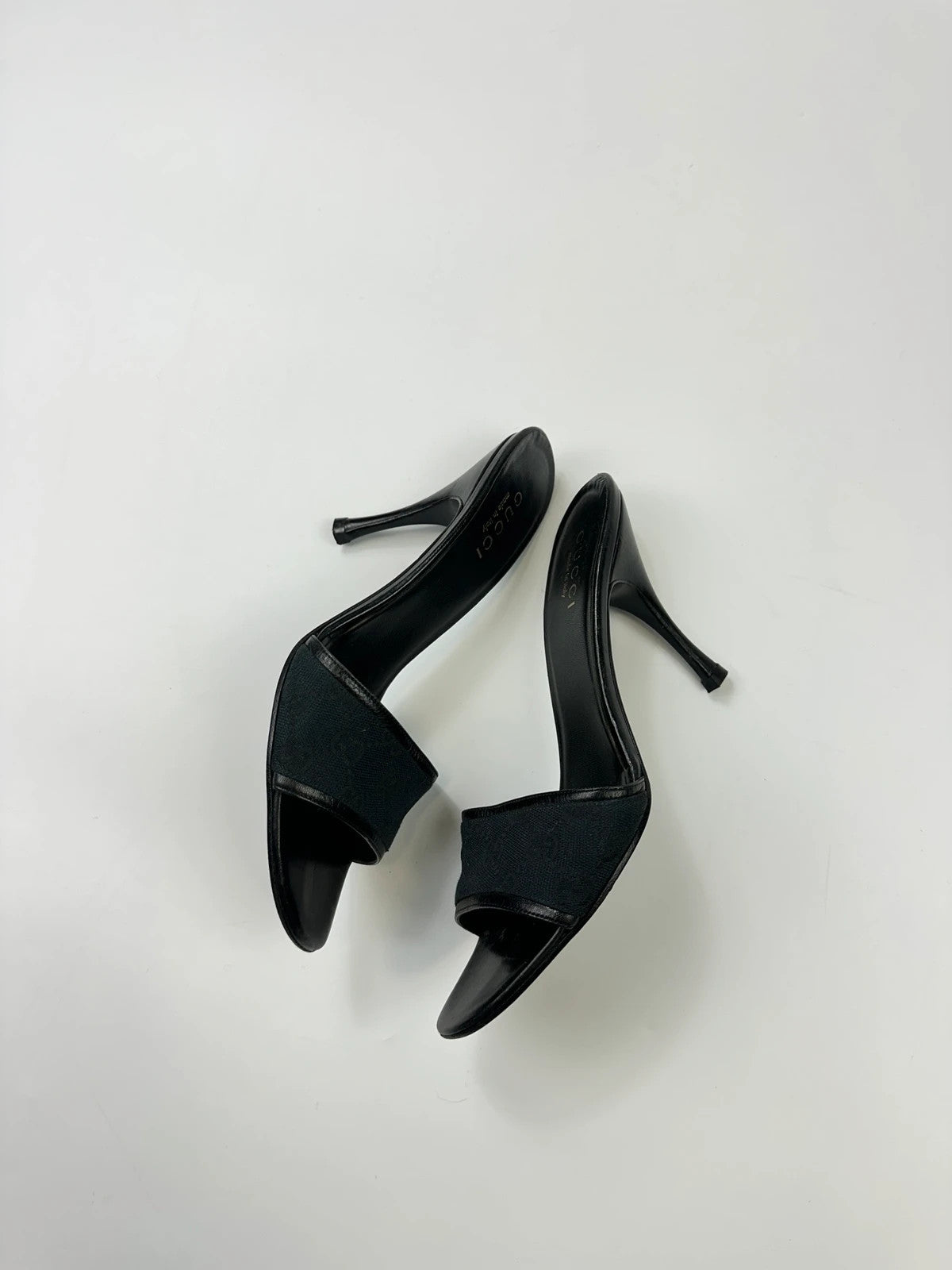 Gucci black heels with canvas monogram pattern and leather accents from the 2000s.