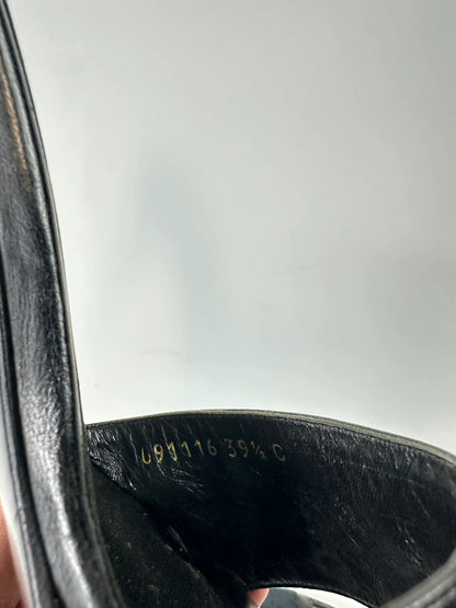 Gucci black heels with canvas monogram pattern and leather accents from the 2000s.