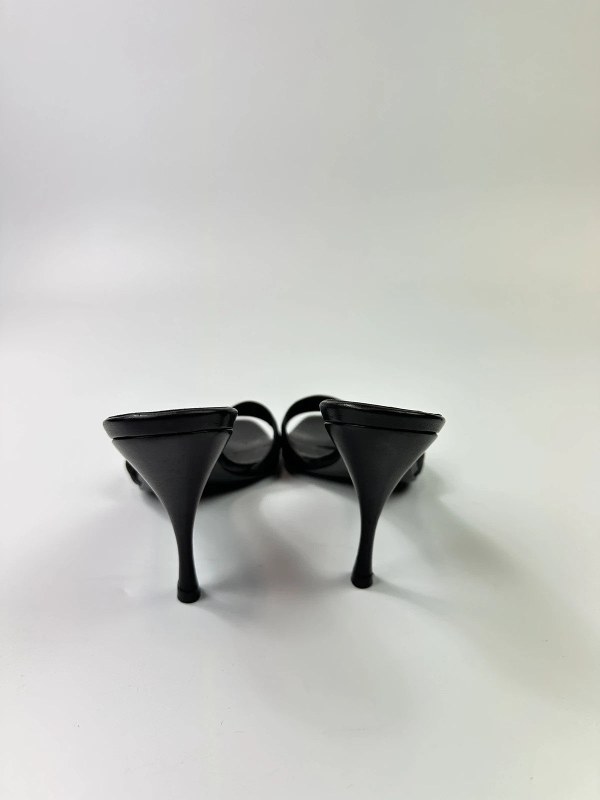 Gucci black heels with canvas monogram pattern and leather accents from the 2000s.