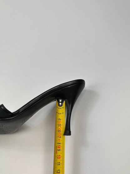 Gucci black heels with canvas monogram pattern and leather accents from the 2000s.