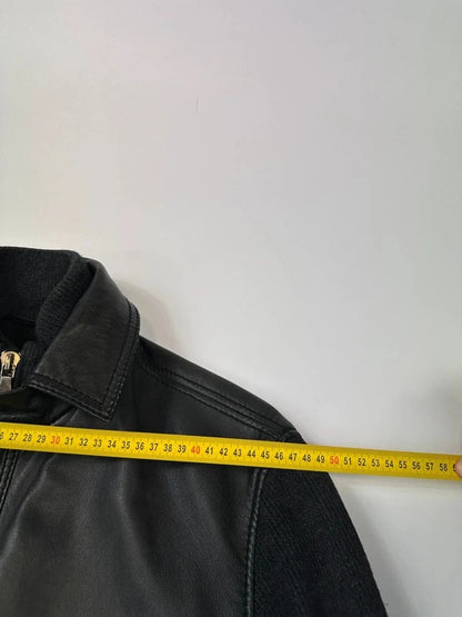 Dolce & Gabbana black bomber jacket with hybrid lamb leather and wool sleeves.