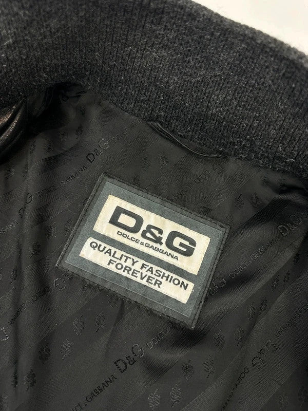 Dolce & Gabbana black bomber jacket with hybrid lamb leather and wool sleeves.
