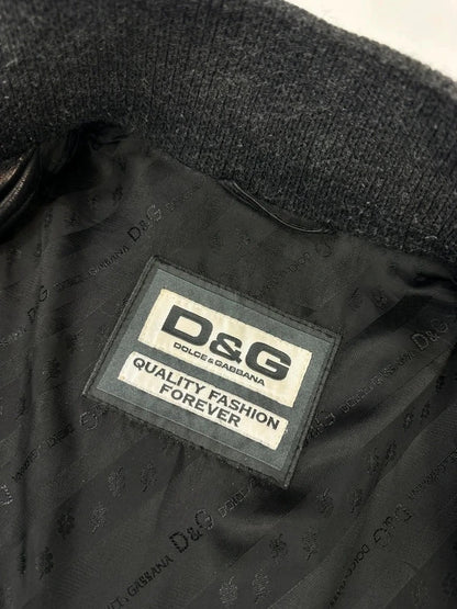 Dolce & Gabbana black bomber jacket with hybrid lamb leather and wool sleeves.