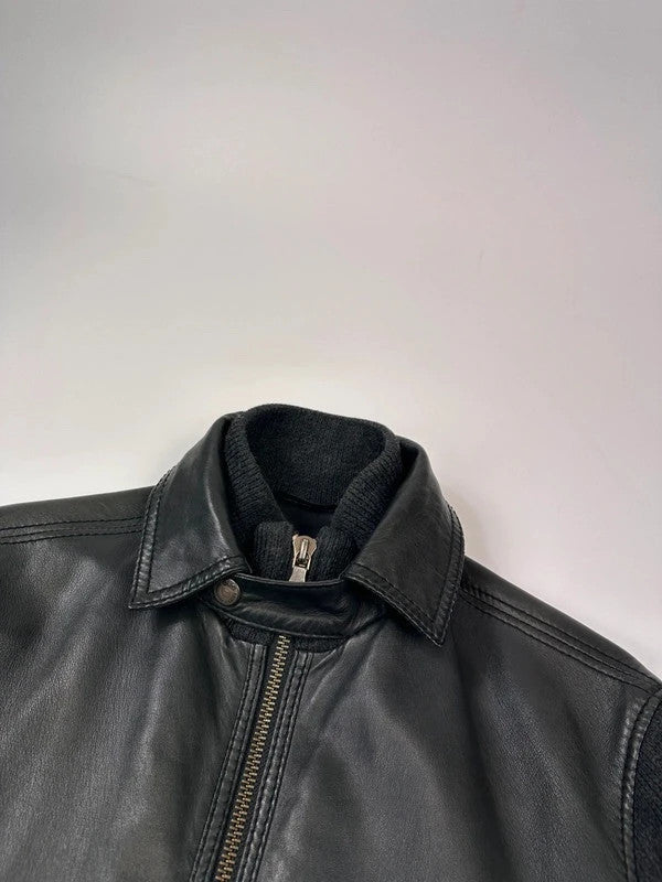 Dolce & Gabbana black bomber jacket with hybrid lamb leather and wool sleeves.