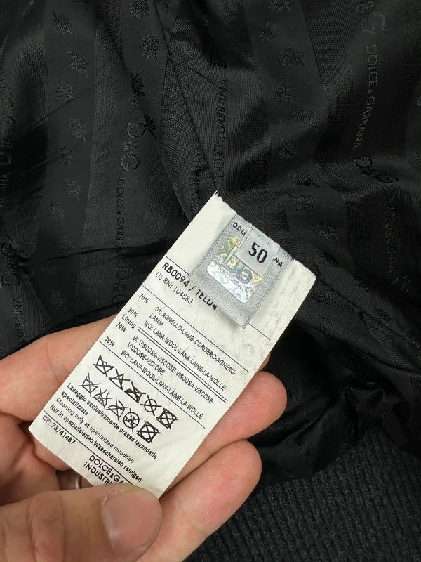 Dolce & Gabbana black bomber jacket with hybrid lamb leather and wool sleeves.