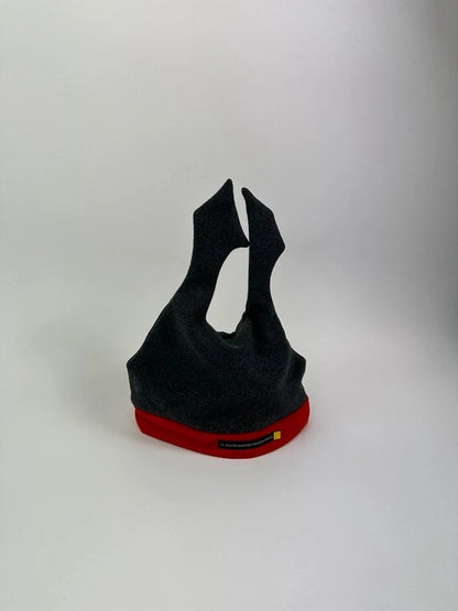 Marithé Francois Girbaud grey and red beanie with devil horns and logo detail.
